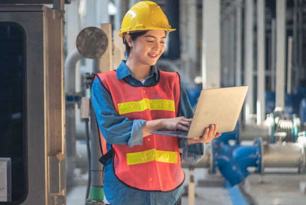 Woman checking safety program on laptop