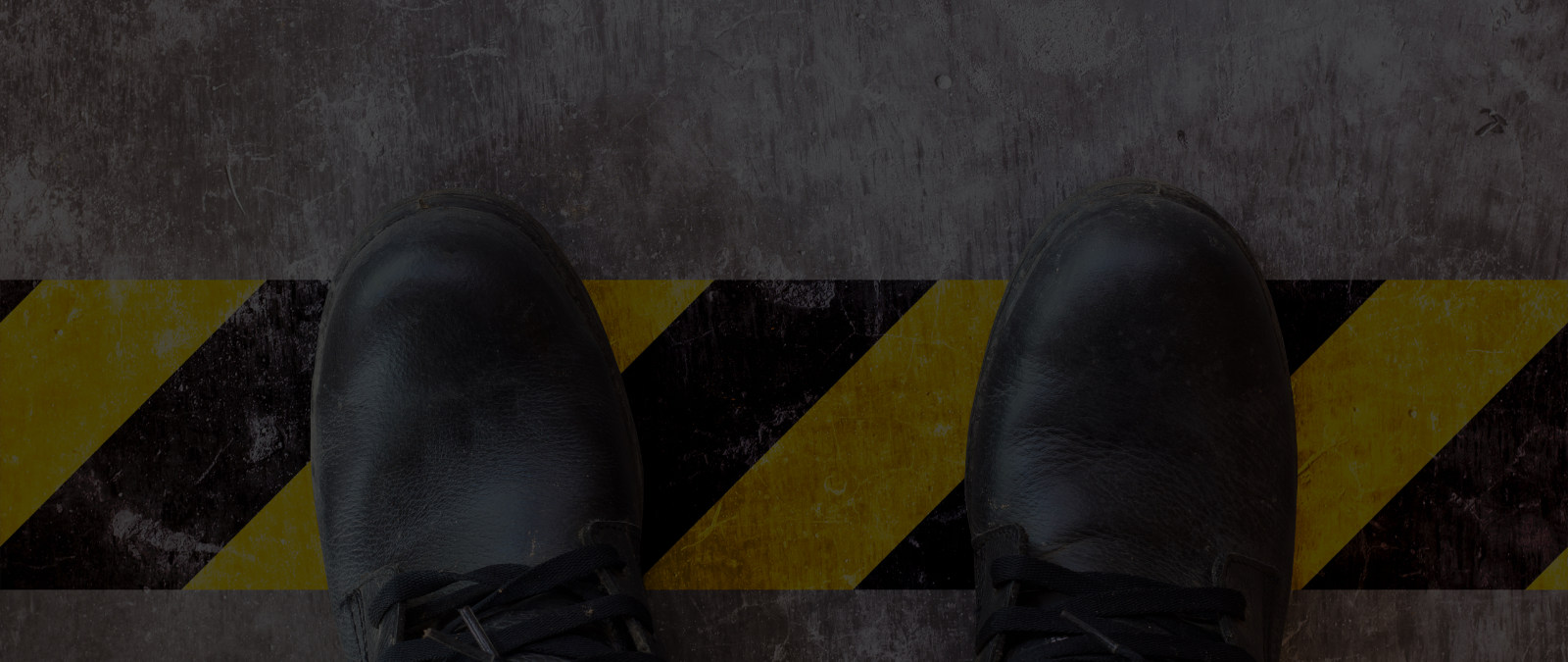 Feet crossing a hazard line